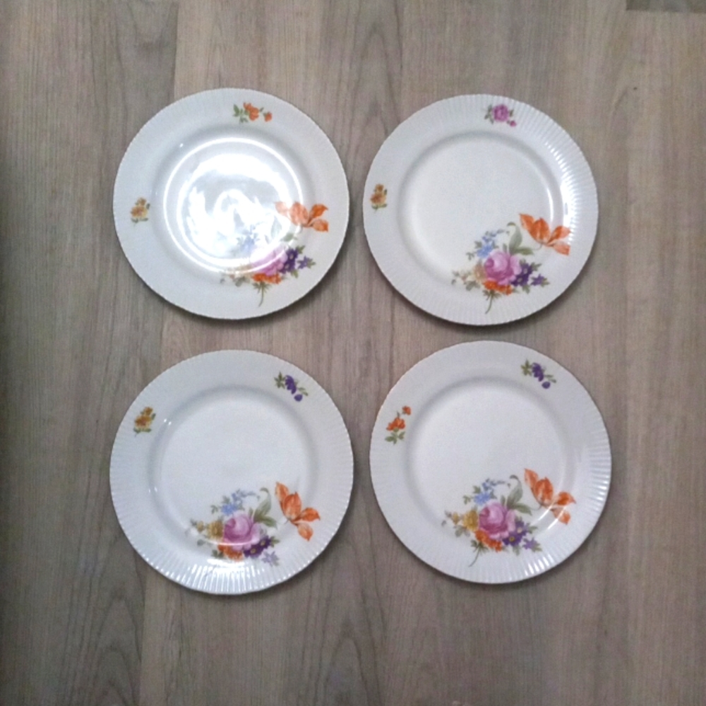 4 dessert plates made by JLMENAU in the German Democratic Republic.